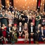 Agroupofwinnersonstageholdingtheirawardsatagalaceremony